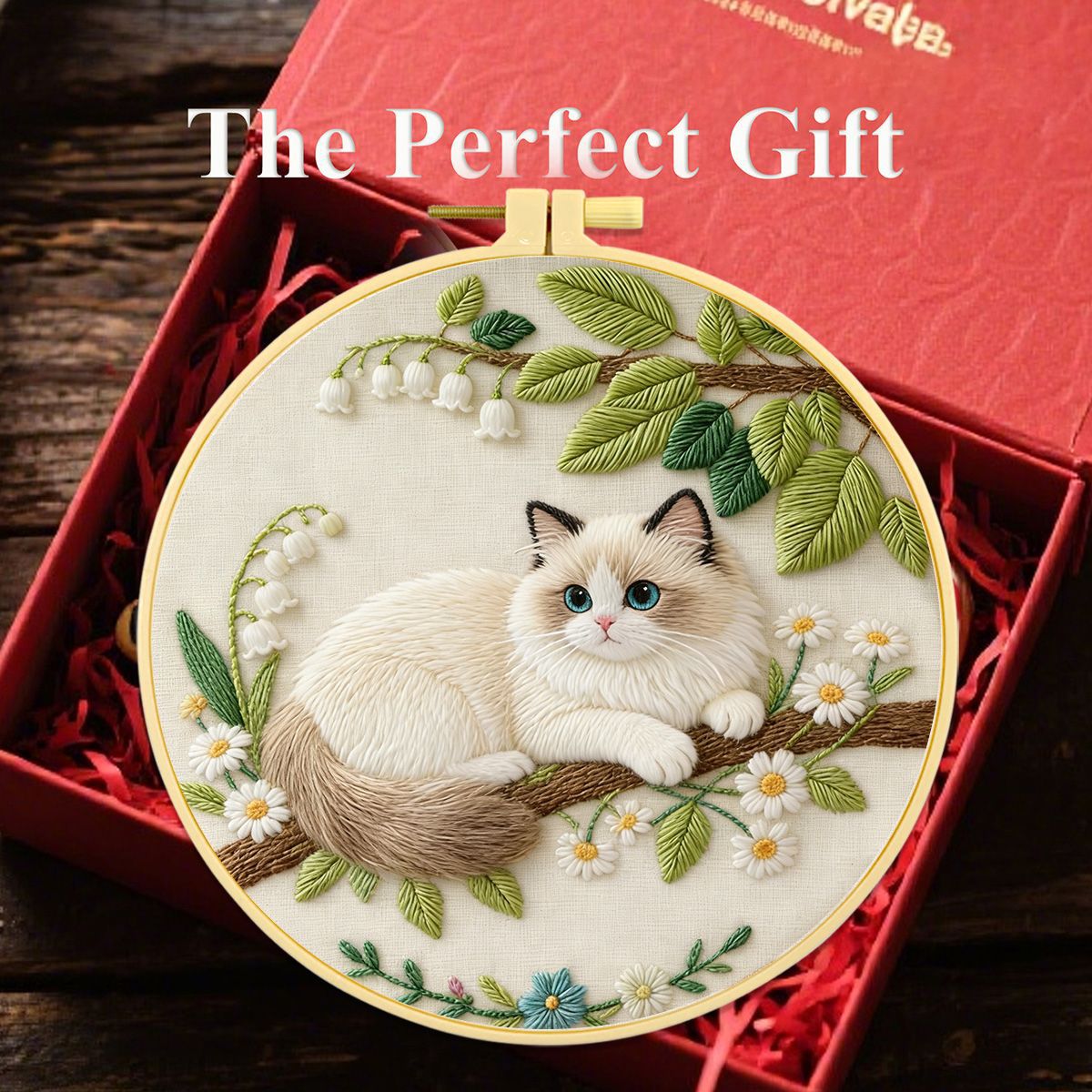 Cat embroidery kit contents laid flat – fabric, threads, needles and guide