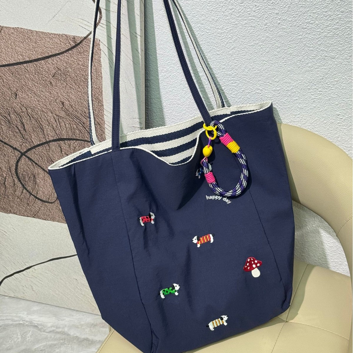 QIUDU embroidered canvas tote bag front view with floral embroidery detail