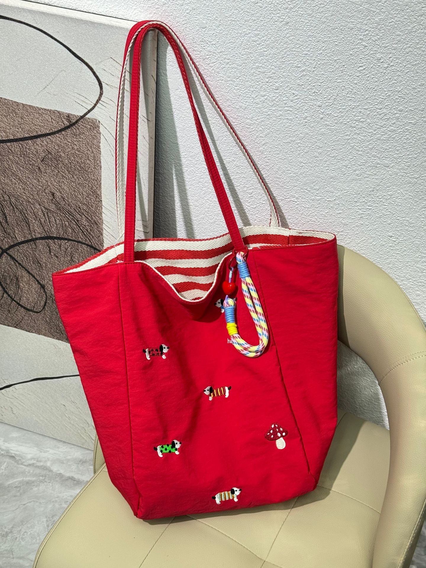 QIUDU embroidered canvas tote bag in royal blue colorway
