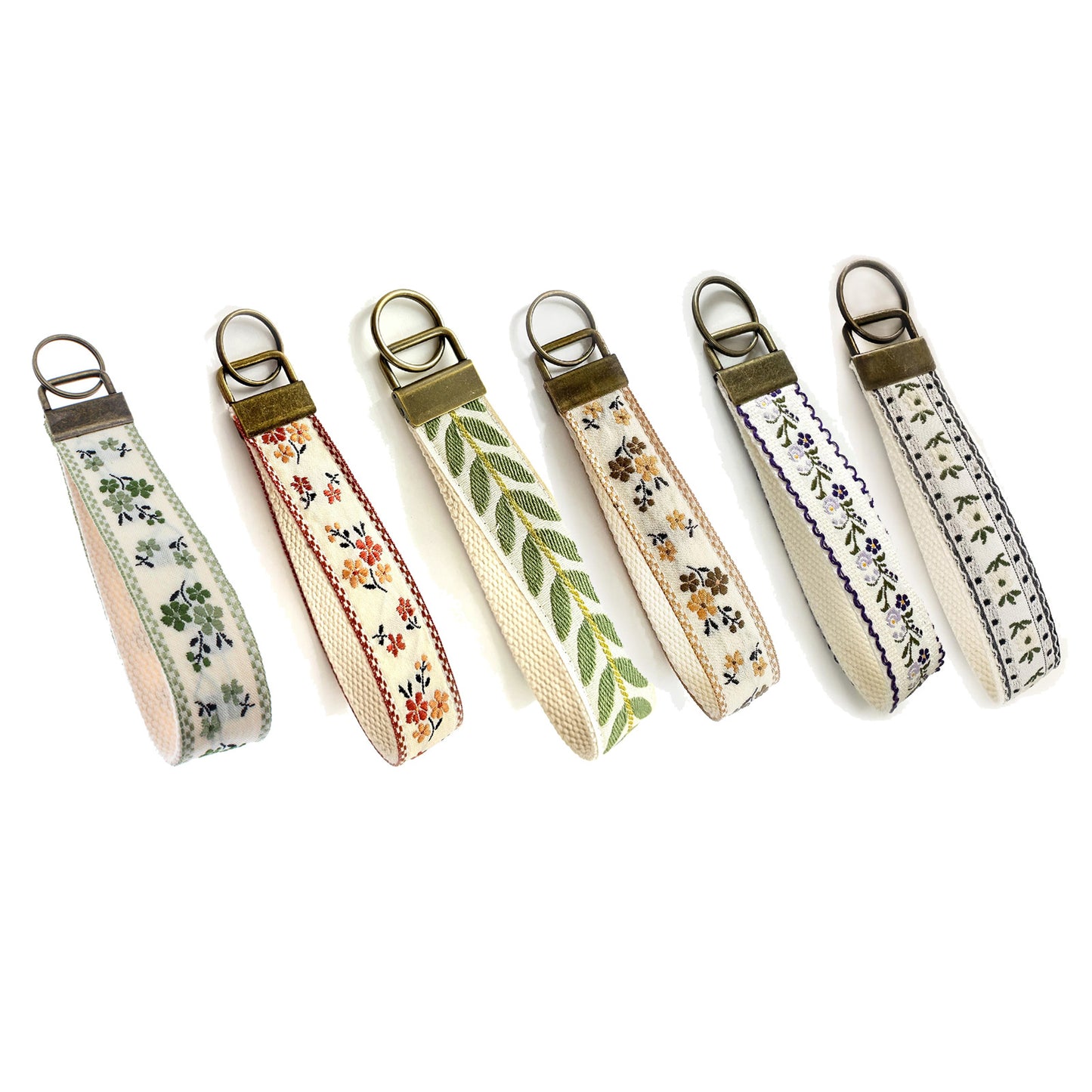 QIUDU embroidered keychain bronze hardware lifestyle shot