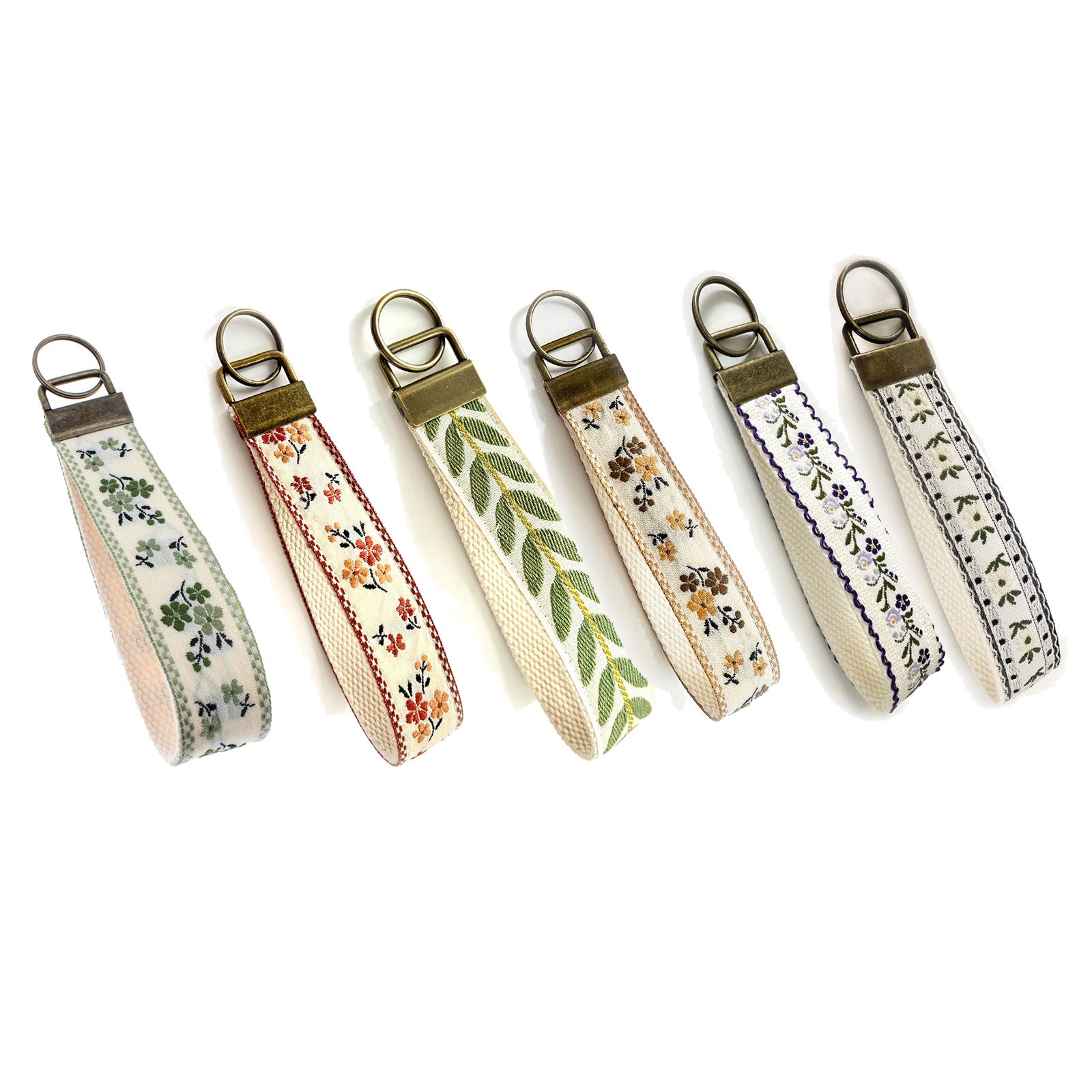 QIUDU embroidered keychain bronze hardware lifestyle shot