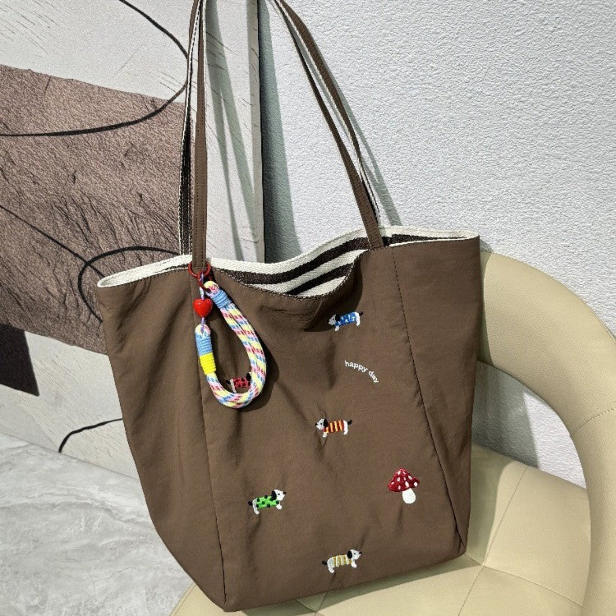 QIUDU embroidered canvas tote bag interior spacious compartment detail