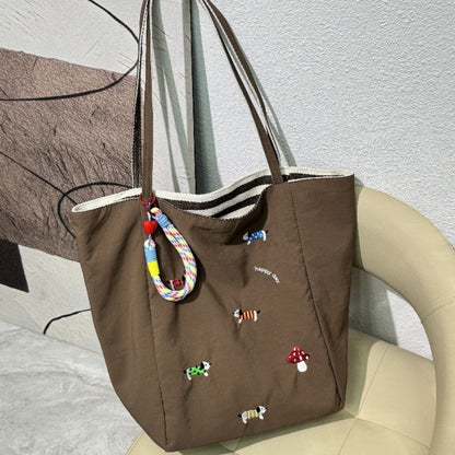 QIUDU embroidered canvas tote bag interior spacious compartment detail