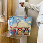 QIUDU Chinese embroidered tote bag owl design lifestyle shot