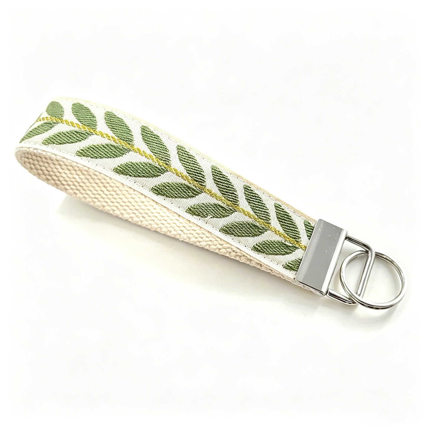QIUDU embroidered keychain multiple styles flat lay