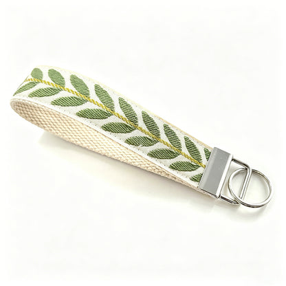 QIUDU embroidered keychain multiple styles flat lay