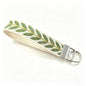 QIUDU embroidered keychain multiple styles flat lay